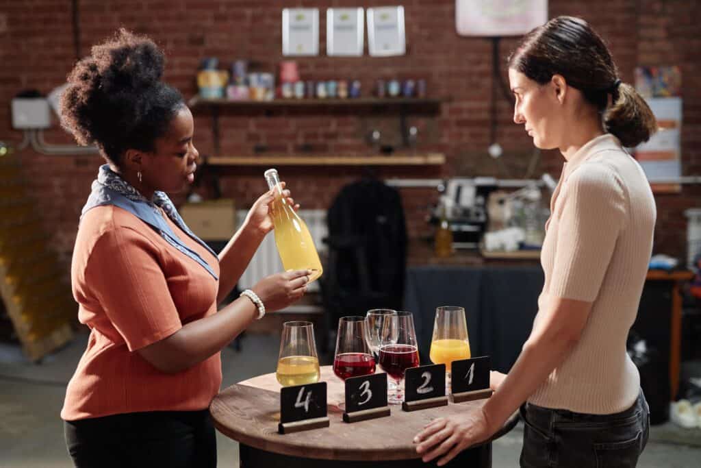 female sommelier holding bottle of cider while tas 2024 11 12 03 34 17 utc min